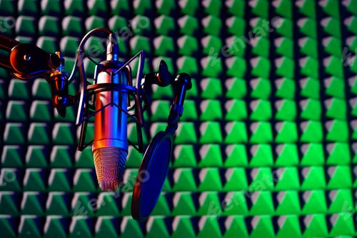 Preview: Professional studio microphone against acoustic foam panel background in neon light