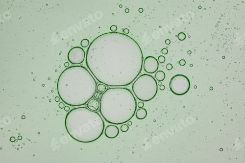 Preview: Close up macro Aloe vera gel serum cosmetic texture green background with bubbles. Cruelty free. gel