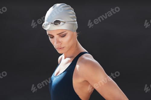 Preview: Fitness model in swimwear over black background