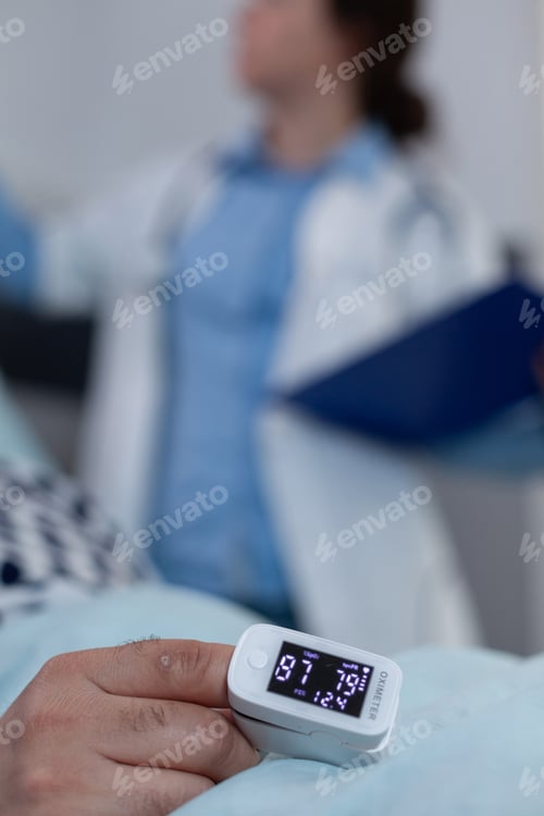 Preview: Closeup of pulse oximeter on patient finger showing low oxygen saturation after surgical