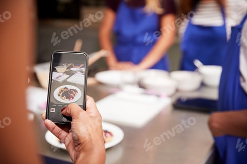 Preview: Close Up Of Woman Taking Photo Of Pancake Dish For Social Media In Cookery Class