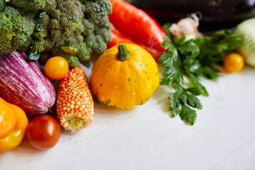 Preview: Top view assorted fresh organic vegetables on table in the kitchen