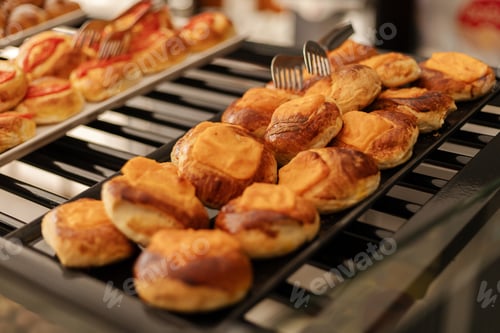 Preview: Various types of pastries, including sweet and savory options, are neatly arranged