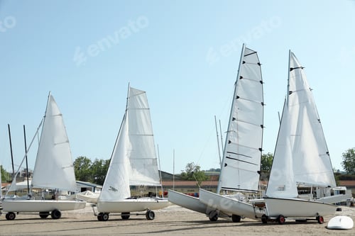 Preview: Seacoast with modern boats on sunny day