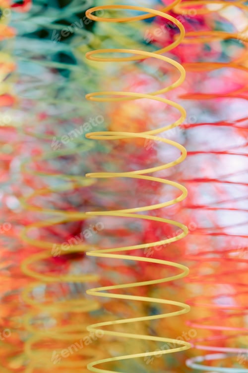 Preview: Lots of bright colorful spirals. Abstract blurred background with selective focus on waves