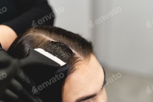 Preview: Focused photo on brush in female hands