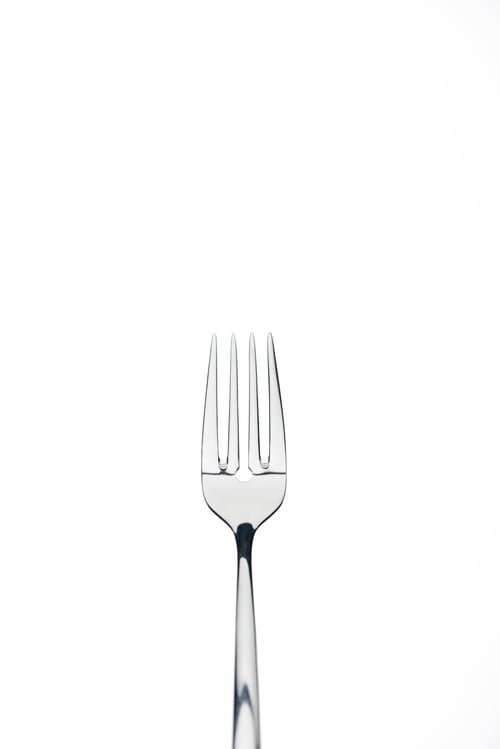 Preview: four-prong metal shiny fork isolated on white isolated on white