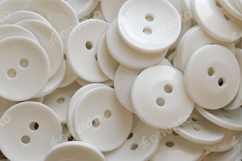 Preview: A lot of identical round white buttons