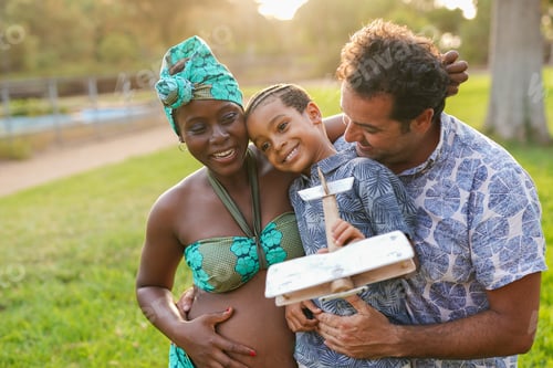Preview: Happy multiracial family having fun together at city park