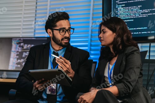 Preview: Software Developers Discussing Code