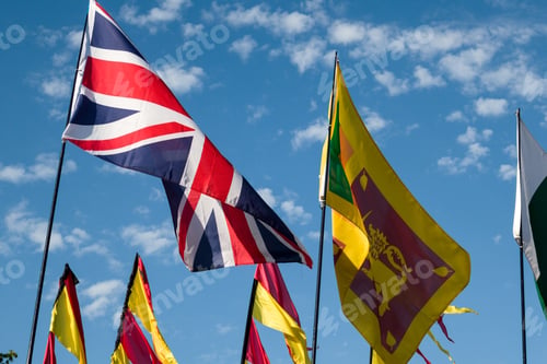 Preview: Closeup of flags with a blue sky background