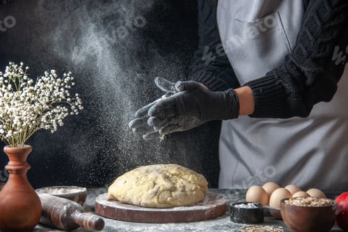 Preview: front view female cook rolling out dough with flour on dark background job raw dough pie oven pastry
