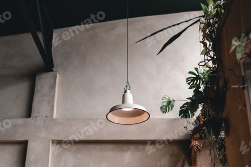 Preview: simple cute metal lamp hanging on a rope on the ceiling at the front door of a nice coffee shop with