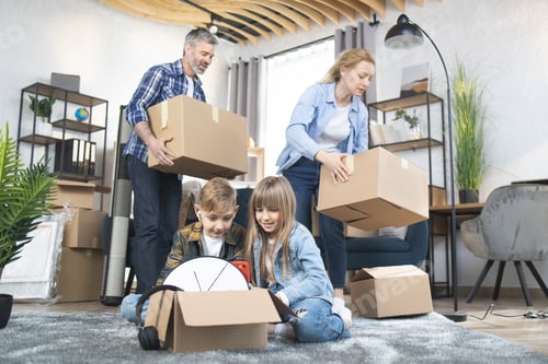 Preview: Caucasian parents and kids packing boxes for moving
