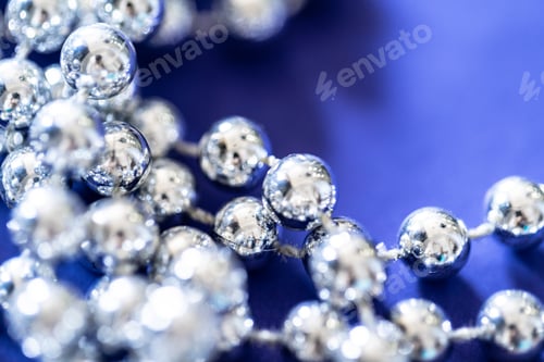 Preview: close up of silver beads. christmas and holiday decoration concept