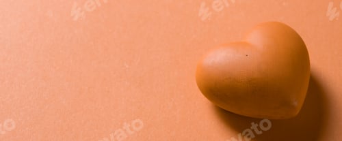 Preview: Valentines day. Red heart with copy space isolated on orange