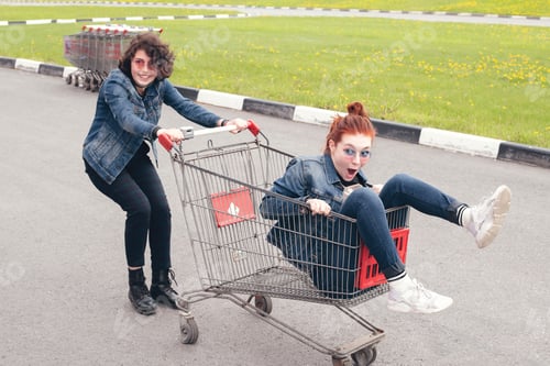 Preview: ↟ ✓ Funny happy teenage girls in denim clothes have fun and ride on the shopping cart