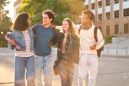 Preview: University students walking on campus with friends talking