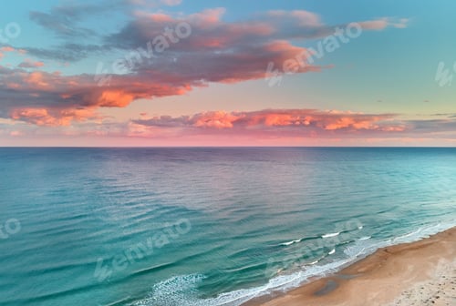Preview: Mediterranean Sea under a colorful sky in La Mata, Torrevieja, Costa Blanca, Spain during sunset