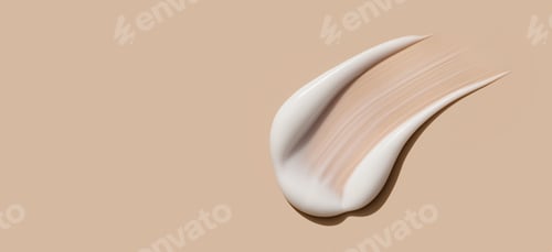 Preview: creamy smear of white cosmetic texture close up on beige background skin care concept