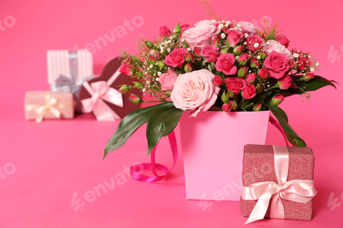 Preview: Composition with beautiful bouquet and gift boxes on color background