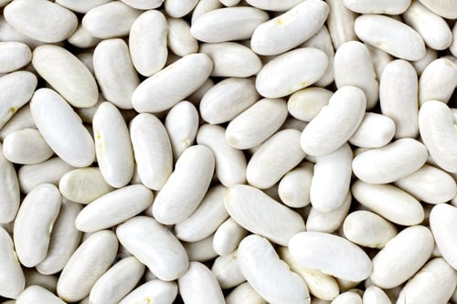 Preview: Navy, haricot, white pea, white kidney or Cannellini beans texture background or pattern. Raw food.