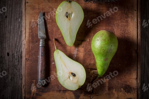 Preview: Three green pears on an old rustic box