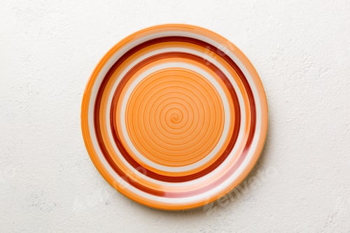 Preview: Top view of empty orange plate on cement background. Empty space for your design