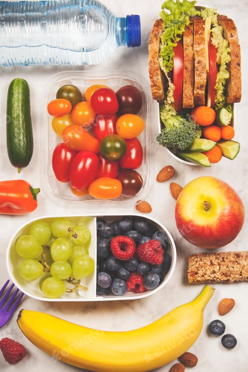 Preview: Healthy lunch box with sandwich and fresh vegetables, bottle of