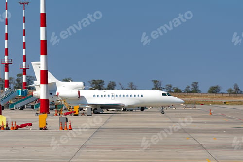 Preview: Airplane is parked near gate of airport terminal