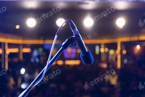 Preview: A microphone on stage with lighting laser beam spotlight show in disco pub club bar for party music