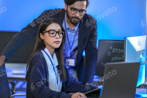 Preview: A data science team collaborates, analyzing a neural network model and code