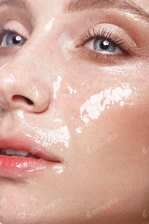 Preview: Beautiful young girl with a light natural make-up and perfect wet skin. Beauty face.