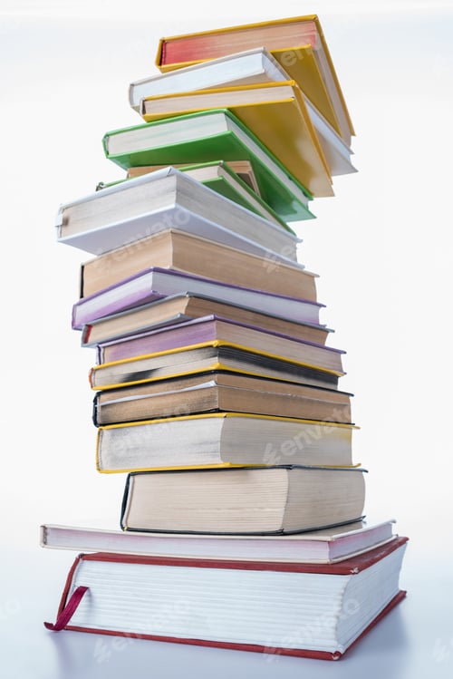 Preview: pile of colored different books on white table