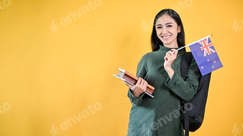 Preview: A pretty Asian female college student is holding her books and the Australia flag. Exchange student