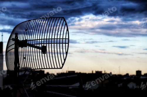 Preview: Scenic view of a communication antenna tower set against a cloudy sky