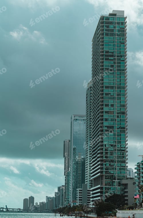 Preview: Stunning image of a city skyline featuring modern skyscrapers against a dramatic sky on a cloudy day