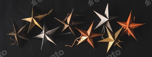 Preview: Christmas, New Year toy stars over black background, wide composition
