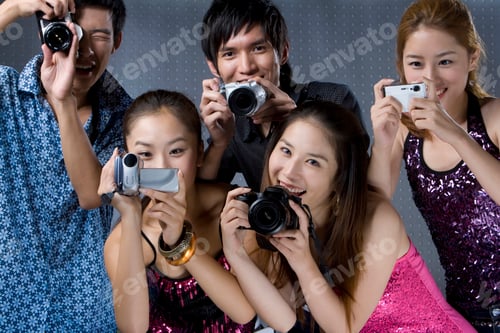 Preview: Young adults using digital cameras