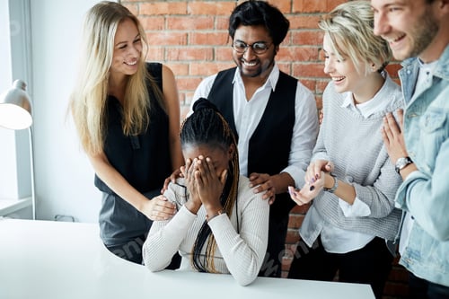Preview: friendly team celebrating their colleague with a baby