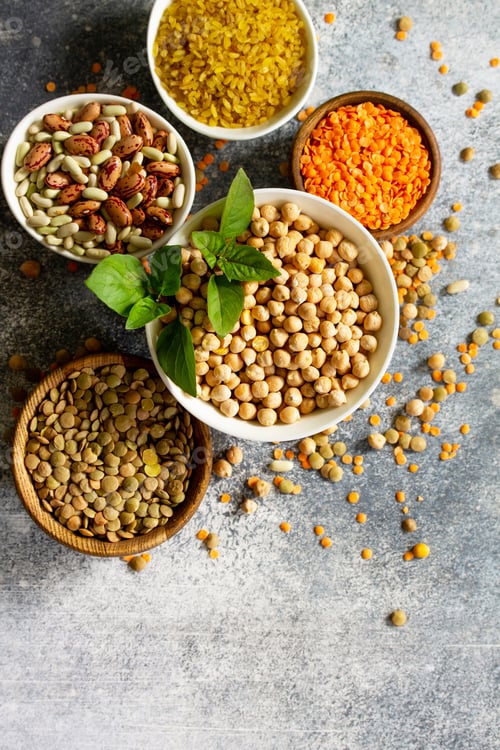 Preview: Healthy food, dieting, concept vegan protein source. Raw of legumes (chickpeas, red lentils.