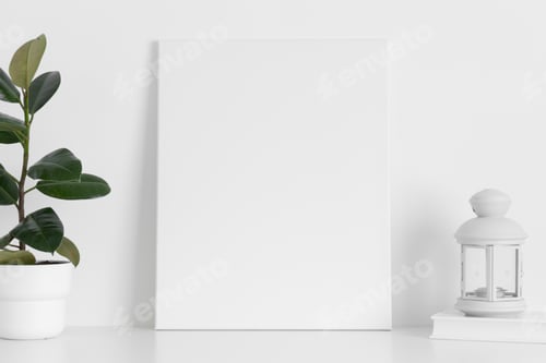 Preview: White canvas mockup with a ficus plant and a candle on the table.