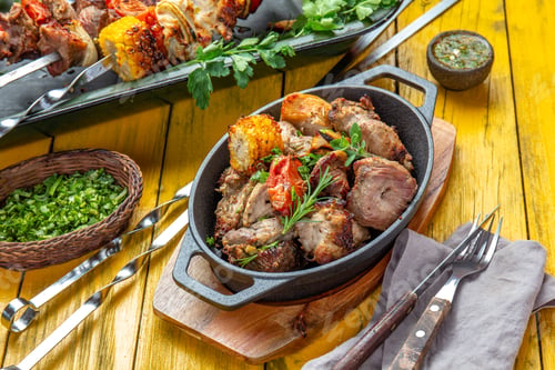 Preview: Bbq grilled meat - pork, chicken and vegetable on pan. Grilled skewers on yellow background.