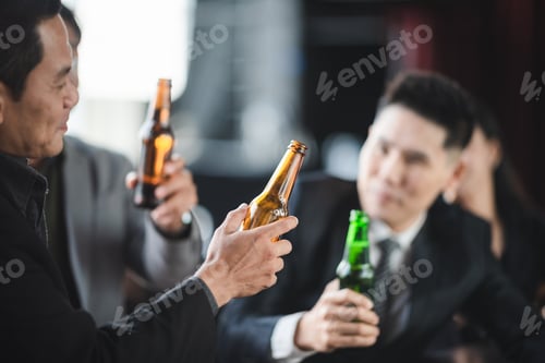 Preview: Business people relax from work in bar, Taking a break from business with beer and wine