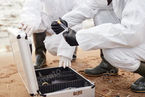 Preview: Close Up of Two Scientists Opening Test Kit