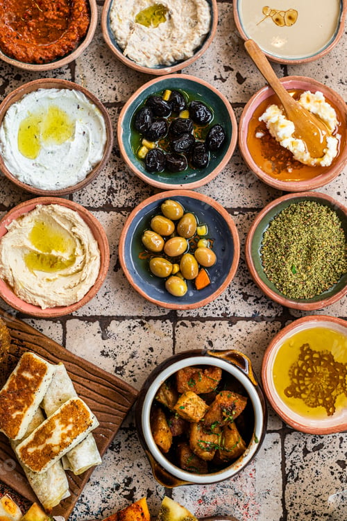 Preview: Turkish Village Breakfast on the ceramic table with pastries, vegetables, greens, spreads, cheeses
