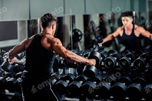 Preview: handsome man workout in gym
