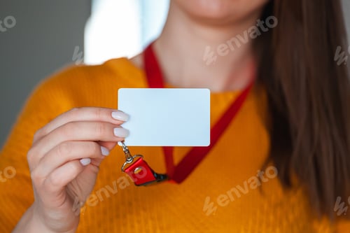 Preview: Woman holding badge name tag, with blank space mock up