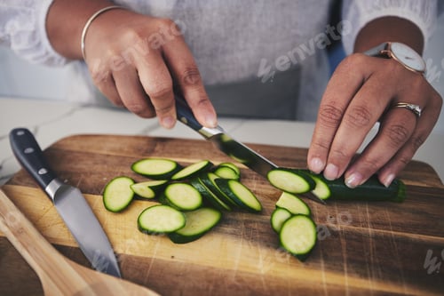 Preview: Cooking, food and hands with cucumber in kitchen on wooden board for cutting, meal prep and nutriti