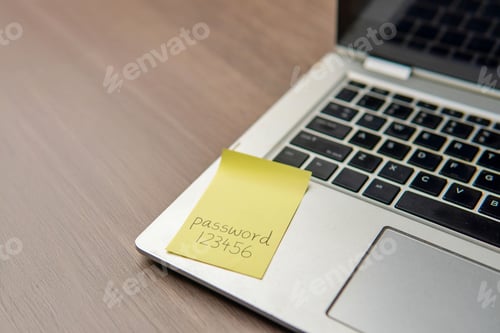 Preview: Sticky note with the word "password 123456" on a laptop keyboard.